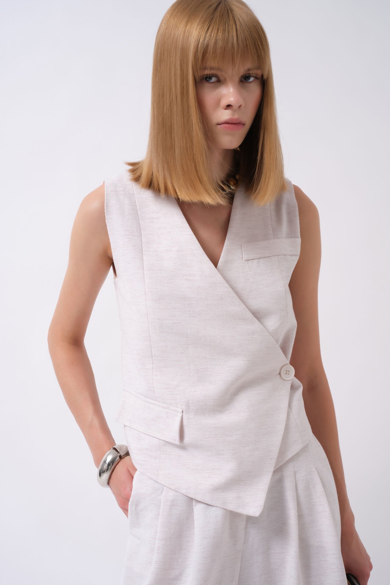 Wholesale Side Button Asymmetrical Beige Vest